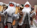Santa Clauses with wooden skis Royalty Free Stock Photo