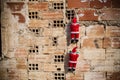 Santa climbing a grunge wall