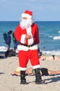 Santa Claus on a beach walking