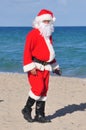 Santa on a beach walking