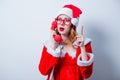 Santa Clous girl with eyeglasses and handset