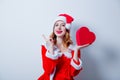 Santa Clous girl with heart shape gift