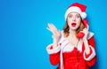 Santa Clous girl in red clothes with handset