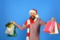 Santa with colorful packets. Christmas shopping and sale concept Royalty Free Stock Photo