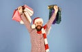 Santa with colorful packets. Man with beard and winner face Royalty Free Stock Photo