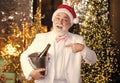 Santa drink champagne. Winter celebration. New year gifts. Winter tradition. Adult party concept. Alcohol. Merry