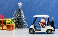 Santa driving golf car, Christmas party Royalty Free Stock Photo