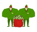 Santa elf and red bag full money. Claus bodyguards. Royalty Free Stock Photo