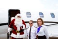 Santa exiting airplane