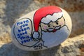 Santa face painted on a small rock Have you been good Royalty Free Stock Photo