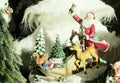 Santa figure with a small deer and squirrel