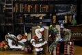 Santa figurine surrounded by Christmas decorations in old library