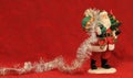 Santa figurine w/tinsel trailing.