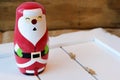 Santa figurine on white wood