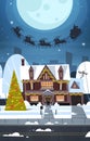 Santa Flying In Sledge With Reindeers In Sky Over Village Houses, Merry Christmas And Happy New Year Banner Winter Royalty Free Stock Photo