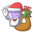 Santa with gift berry smoothie mascot cartoon