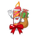 Santa with gift decorative christmas candles isolated on mascot