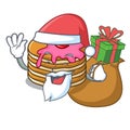 Santa with gift pancake with strawberry mascot cartoon