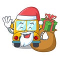 Santa with gift school bus mascot cartoon