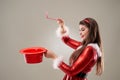 Santa girl magician with copyspace