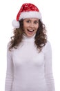 Santa girl in red Christmas cap surprised Royalty Free Stock Photo
