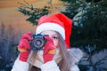 Santa girl with SLR camera Royalty Free Stock Photo