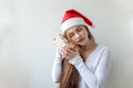 Girl in Santa hat with chrismass gift