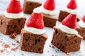 Santa Hat Brownie Bites with strawberries and whipped cream or c Royalty Free Stock Photo