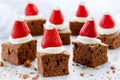 Santa Hat Brownie Bites with strawberries and whipped cream or c Royalty Free Stock Photo