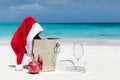 Santa hat on champagne bucket on a tropical beach Royalty Free Stock Photo