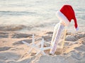 Santa hat on message in bottle with starfish