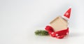 Santa hat with miniature house model over blank chalkboard Royalty Free Stock Photo