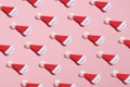 Santa hat pattern on pink background. Christmas, winter holidays, New year concept. Minimal style Royalty Free Stock Photo