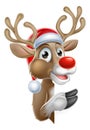 Santa Hat Reindeer Pointing from Behind Sign Royalty Free Stock Photo