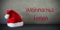 Santa Hat, Text Weihnachtsferien Means Christmas Holidays