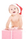 Santa helper baby with christmas gift Royalty Free Stock Photo