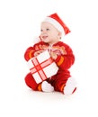 Santa helper baby with christmas gift Royalty Free Stock Photo