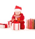 Santa helper baby with christmas gifts Royalty Free Stock Photo