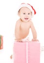 Santa helper baby with christmas gifts Royalty Free Stock Photo