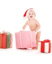 Santa helper baby with christmas gifts Royalty Free Stock Photo