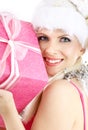 Santa helper girl with pink gift box Royalty Free Stock Photo