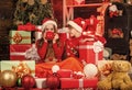 santa helpers among red present boxes. too much gifts. after successful shopping. childhood happiness and carefree. cosy