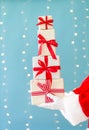 Santa holding Christmas gift boxes Royalty Free Stock Photo