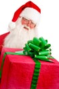 Santa Holding Christmas Present in his Hands on a White Backgrou Royalty Free Stock Photo