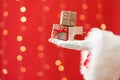 Santa holding small Christmas gift boxes Royalty Free Stock Photo