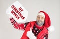 Santa is holding a white sign with the inscription - My Christmas bonus Royalty Free Stock Photo