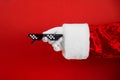 Santa holds funny swag pixilated boss sunglasses on red background. Gangster, Black thug life meme glasses. Pixel 8bit style Royalty Free Stock Photo