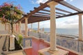 Santa Luzia viewpoint miradouro with columns and tiles in the foreground and Santa Estevao Church and Tagus river in the backgro Royalty Free Stock Photo