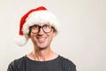 Santa man portrait. Christmas concept. Funny man wearing glasses and christmas hat. Happy New Year. Copy space