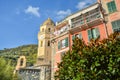 The Santa Margherita di Antiochia Church with it's bell tower and clock at the village of Vernazza, Cinque Terre Italy